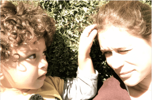 A mother and her young son, looking at each other